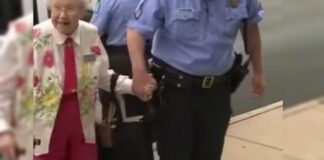 102 metų moteris buvo surakinta antrankiais ir palydėta iki policijos automobilio. Sužinokite, kodėl tai įvyko!